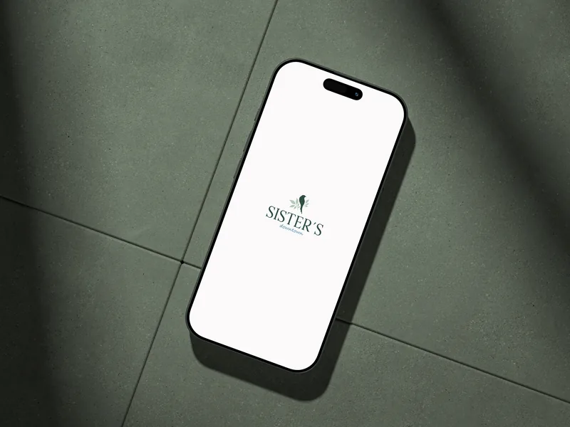 A phone showing only the logo, on sage tile